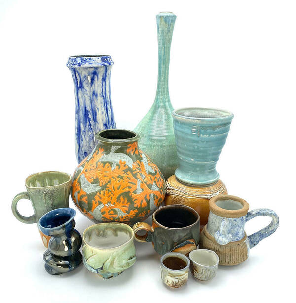 Numerous pottery of various sizes and colors grouped together on a white background.